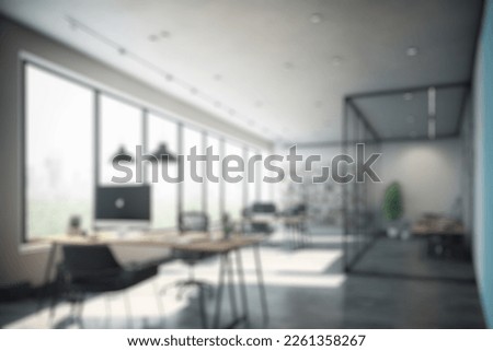 Blur background of modern office interior design workspace background  for corporate office. The office in modern style with glass background. Table and desk background in office blurred backgrounds.