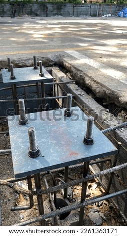 Reinforced concrete foundation with metal bolts, foundation of pole on the construction site