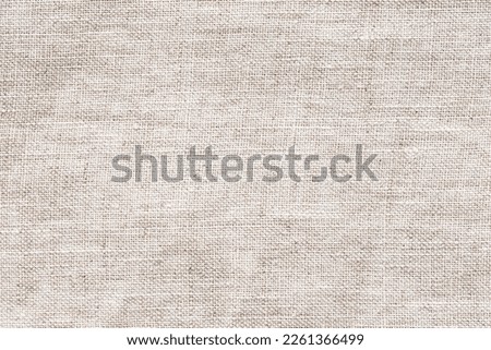 Natural brown linen fabric background. Fiber structure texture. Vintage canvas pattern. Royalty-Free Stock Photo #2261366499