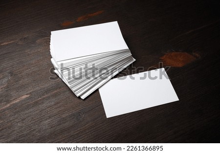 Blank business cards on wooden background. Template for graphic designers portfolios.