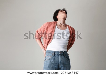 Confident young man posing indoor over white background. Mock-up.