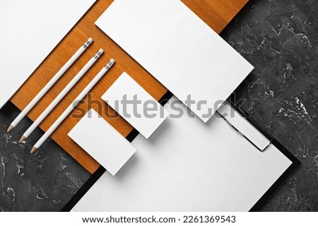 Blank corporate identity template. Photo of blank stationery set. Mockup for design presentations and portfolios. Flat lay. Royalty-Free Stock Photo #2261369543