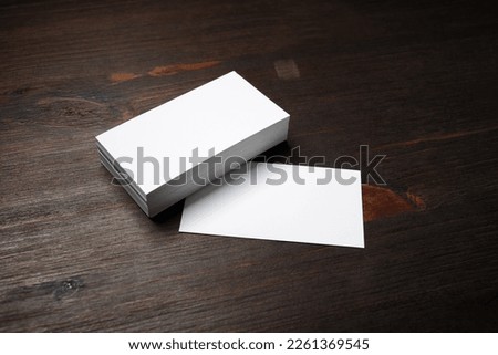 Blank business cards template on wood table background. Template for graphic designers portfolios.