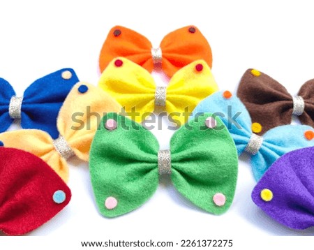 Hair clips, hairpins, bow tie isolated on white background. Collection set of colorful ribbon crafts from flannel. Fashion design hair accessories for girl Royalty-Free Stock Photo #2261372275
