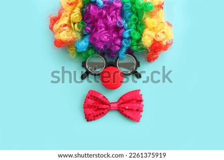 carnival, party and Purim celebration concept (jewish carnival holiday) over blue background