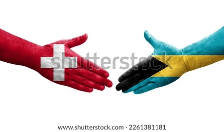Handshake between Switzerland and Bahamas flags painted on hands, isolated transparent image.