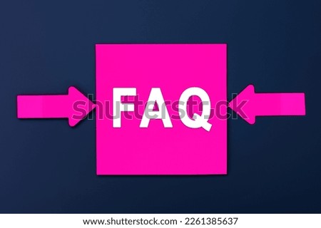 FAQ - Frequently Asked Questions - inscription of a magenta paper notes and two colorful arrows over a dark blue background. Top view. Instructions and rules on Internet sites