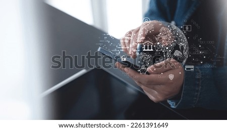 Woman using mobile phone for online banking with global network on virtual screen. E-commerce. Online payment via mobile banking app, E-transaction, virtual bank, financial technology concept Royalty-Free Stock Photo #2261391649