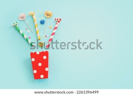 Top view image of party and present objects on pastel background