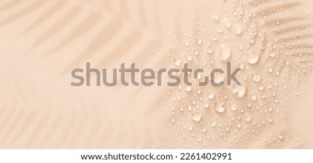banner drops on a pastel beige background with place for text Royalty-Free Stock Photo #2261402991
