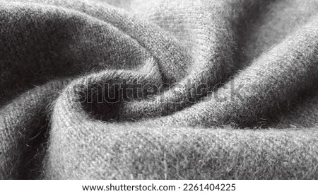 Natural cashmere gray fabric. Knitwear. Cashmere, wool. Texture of natural wool fabric. Royalty-Free Stock Photo #2261404225