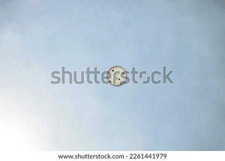 A weather balloon shoots of up into the upper atmosphere to read weather conditions Royalty-Free Stock Photo #2261441979
