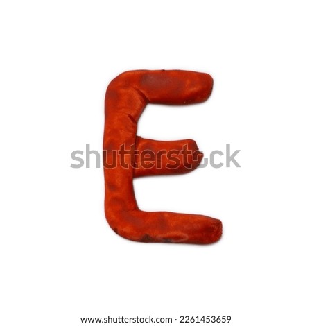 English alphabet. Plasticine letters with their own hands. Salty dough. Letter E handmade on a white background.