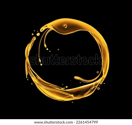 Splashes of oily liquid arranged in a circle on a black background