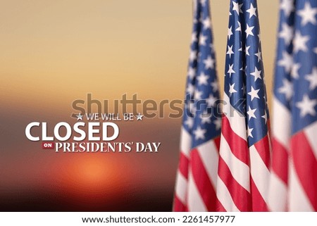 Presidents Day Background Design. American flags on a background of orange sky at sunset with a message. We will be Closed on Presidents Day. Royalty-Free Stock Photo #2261457977