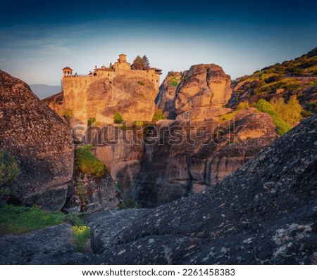 Dramatic summer view of famous Eastern Orthodox monasteries listed as a World Heritage site, built on top of rock pillars. Stunning morning scene of Kalabaka, Greece. Traveling concept background.

