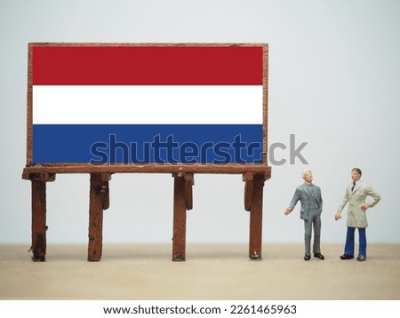 Mini toy at table with white background. Holland flag design.