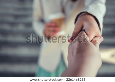 Shot of two unrecognizable women shaking hands