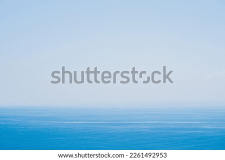 View in the morning sky is bright blue with clear white clouds meet the line of the sea at the horizon line - Amazing and beautiful nature ocean and seascape - Calm, Smooth, Tranquility as heaven. Royalty-Free Stock Photo #2261492953
