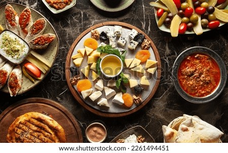 Assortment of cheeses, olives, Turkish snacks. Turkish breakfast Royalty-Free Stock Photo #2261494451