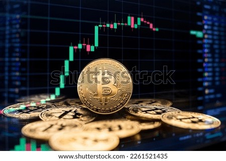 Bitcoin and cryptocurrency investing concept with graph. Bitcoin cryptocurrency coins symbol. Trading on the cryptocurrency exchange. Trends in bitcoin exchange rates. Rise and fall chart of bitcoin. Royalty-Free Stock Photo #2261521435