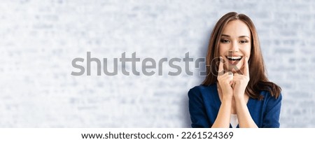 Dental dent health care concept picture - happy excited beautiful woman in blue cloth show white toothy smile. Portrait image brunette girl, on bricks wall background, wide banner copy space ad design