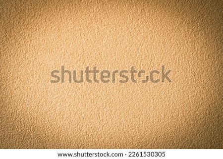Abstract vignetting brown beige plastered wall background.