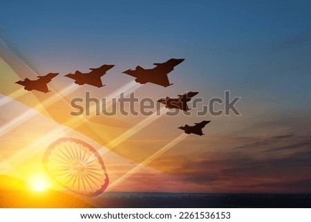 Indian Air Force Day. Indian jet air shows on background of sunset with transparent Indian flag. Commemorate Indian Air Force Day on October 8 in India. Royalty-Free Stock Photo #2261536153