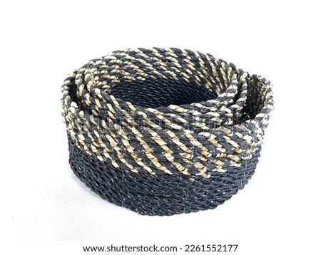 Black and Natural Round Basket weaving made from Pandanus odorifer or fragrant screw-pine on a white background for product photography