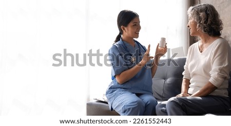Young nurse advise and give advice medicines are given to patients in the examination room of a hospital or clinic, Medical service Royalty-Free Stock Photo #2261552443