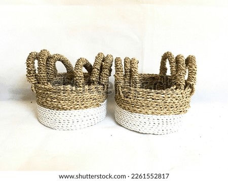 Multi colored Round Basket weaving With handle made from Pandanus odorifer or fragrant screw-pine on a white background for product photography
