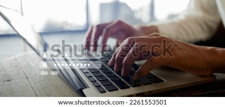 close up businessman hand type on laptop keyboard to access account on website by input username and password at office for security system of business technology concept Royalty-Free Stock Photo #2261553501