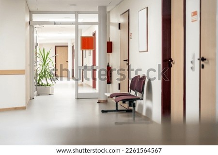 empty waiting room in a clinic or hospital, corridor or hallway with green plant Royalty-Free Stock Photo #2261564567