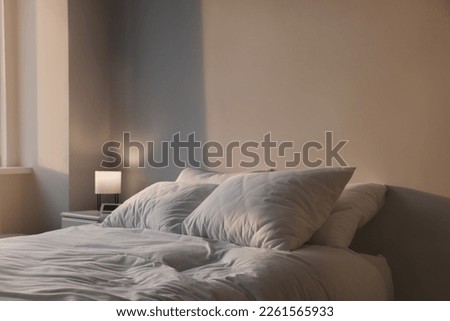 White soft pillows on bed in room Royalty-Free Stock Photo #2261565933