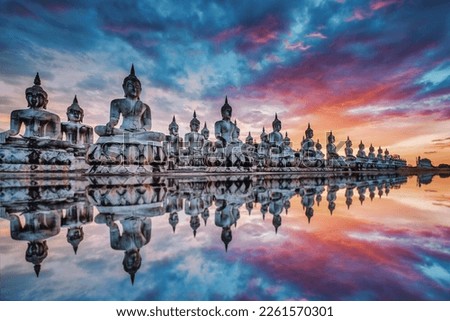 Many Statue buddha image at sunset in southen of Thailand
