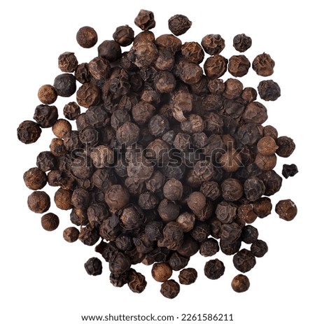 Whole black peppercorns, isolated on a white background, close up Royalty-Free Stock Photo #2261586211