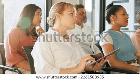 Tablet, notes or business woman learning at a trade show, conference or seminar event for startup management advice. Crowd, audience or business people listening to a speaker for financial knowledge Royalty-Free Stock Photo #2261588935