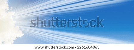 Holy spirit religious long banner.Blue sky with the rays of the sun coming out of a white cloud. Religion background with blue sky and sunbeams.Panoramic view.