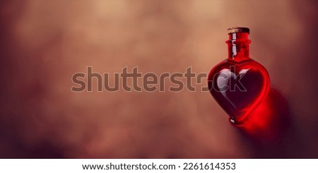 Love potion in a glass vessel. Bottle with love potion. Magic elixir for Valentines day. Royalty-Free Stock Photo #2261614353
