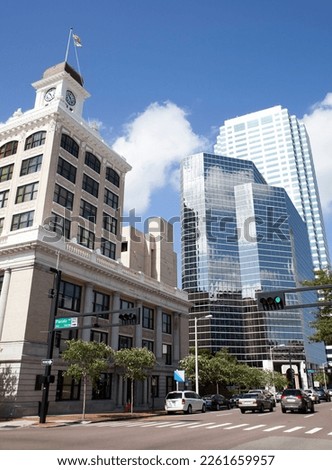 The view of historic Tampa city hall and modern glass covered skyscrapers in a background (Florida).