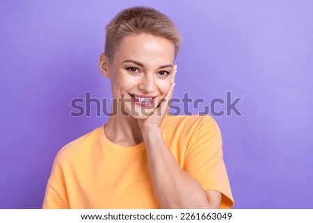 Portrait photo of cheerful attractive young positive lovely lady touch cheeks look you beautiful girlfriend isolated on purple color background