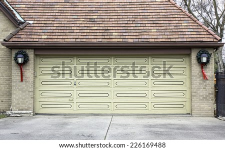 Two car wooden garage with Christmas decoration
