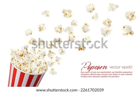 Flying popcorn flakes with bucket. Striped pop corn box realistic vector mock up, white and red paper container with snack seeds floating in air, 3d concept for cinema or movie theater promotion Royalty-Free Stock Photo #2261702039