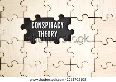wooden puzzle with the word CONSPIRACY THEORY Royalty-Free Stock Photo #2261702105