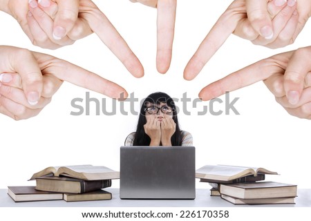 Asian student bullied by people while studying, isolated over white background Royalty-Free Stock Photo #226170358