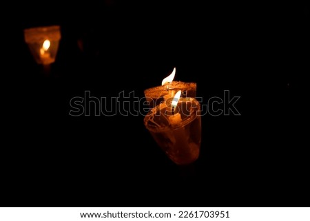 Candles in the dark during a lookout tour. Concept of traditions, religion, customs and beliefs (South America, Peru).