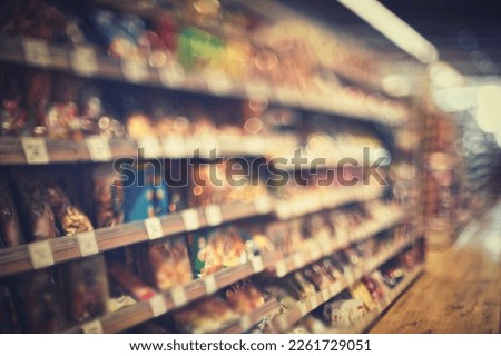 Supermarket shelf blur and shopping image Royalty-Free Stock Photo #2261729051