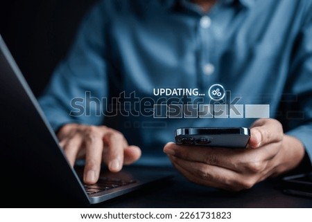 Update software system in computer. Man using smartphone upgrade program, Business technology internet loading virtual bar with installing the update for the quality better.	
 Royalty-Free Stock Photo #2261731823