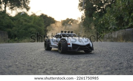 RC Sports car with spray, black and white color rc toy 2 Royalty-Free Stock Photo #2261750985