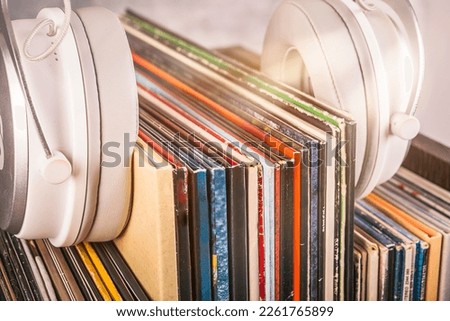 Vinyl records and headphones in retro and rustic style Royalty-Free Stock Photo #2261765899